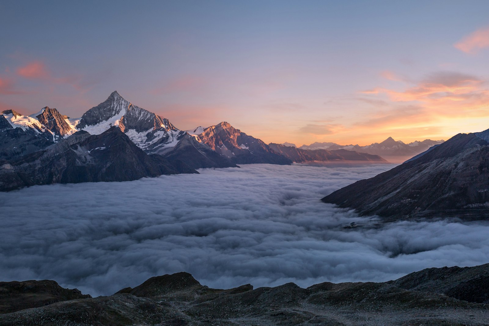 Mountain sunrise with dramatic light over peaks