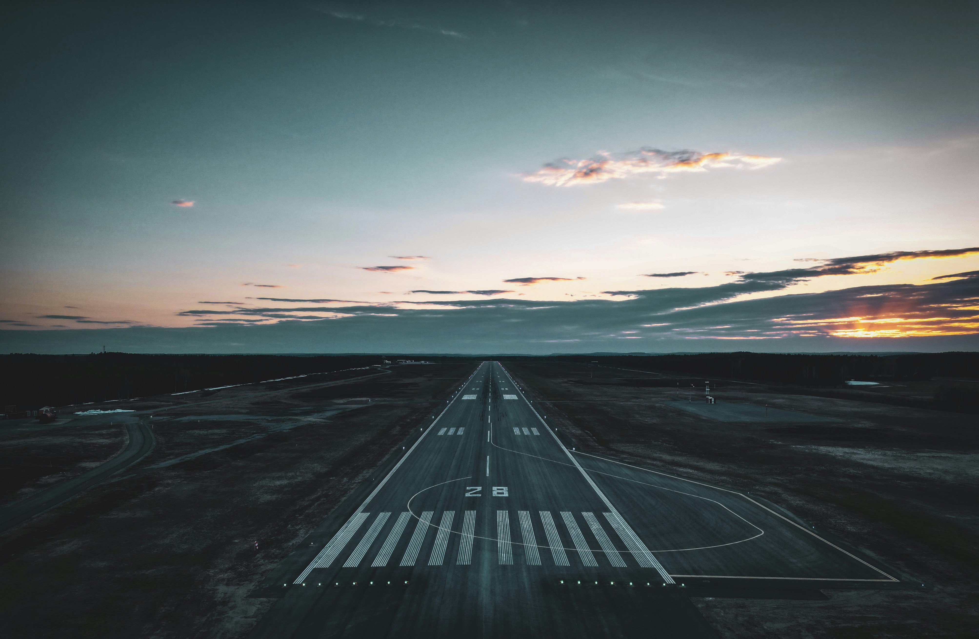Runway stretching toward the horizon at sunset